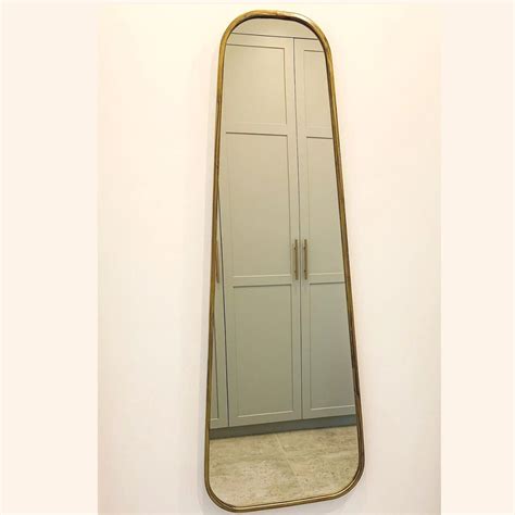 West mirrors. Its versatile design allows you to keep it on the ground, lean it against the wall, or mount it on any wall to save space. Size: 59 x 22 Inches. Mirror includes a stand so you can use it as a free standing mirror in the corner of your room. You can also remove the stand and hang it on the wall. Material: aluminum + mirror. 