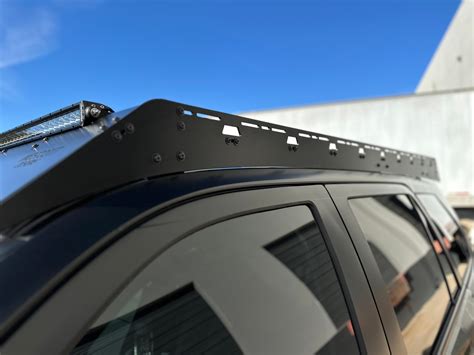 The Westcott Designs 2010+ 4Runner Roof Rack features extruded aluminum crossbars and an extreme low profile that has an installed height of just 3.5 inches. You have the choice between 4 different front valence options, allowing customization that you won't find on most roof rack wind deflectors.. 