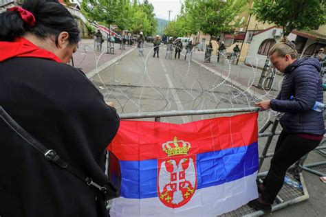 Western efforts to defuse Kosovo crisis mount as ethnic Serbs in Kosovo rally anew after clashes