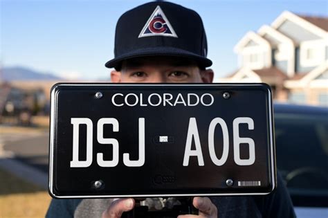What’s driving Colorado’s obsession with the new retro black license plates?