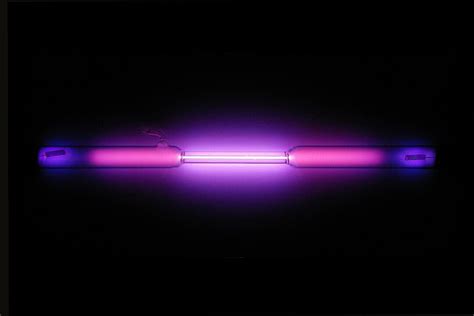 What does liquid neon look like.  Upon freezing it forms a crystal with ...