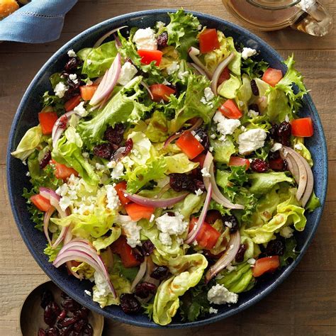  Salad. A garden salad platter served with bread and dressing on the side, consisting of lettuce, beetroot, cucumber, scallions, cherry tomatoes, olives, sun-dried tomatoes, and feta. Main ingredients. Pieces of vegetables, fruits, eggs, or grains mixed with a sauce. Variations. . 