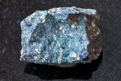 Kimberlite is a bluish rock that diamond miners look for when seeking out new diamond deposits. The surface area of diamond-bearing kimberlite pipes ranges from 2 to 146 hectares (5 to 361 acres). Diamonds may also be found in river beds, which are called alluvial diamond sites .. 