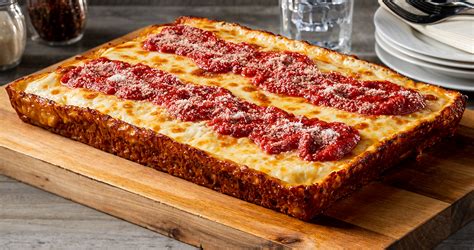 What is detroit style pizza. Detroit Style Pizza. Halifax, start your taste buds! ORDER NOW Direct from the motor city. Introducing Detroit Style Pizza. Upside down, square, iconic and delicious. BUY NOW "Detroit" style pizza? What is it? Well, it’s like no other pizza you’ve ever tasted. The key components are the crust, the cheese, and the square pan it’s baked in. 