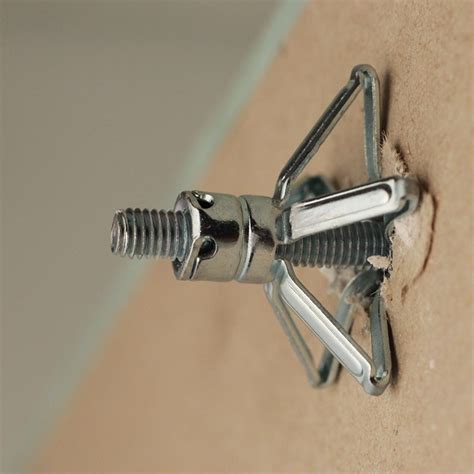 The toggle bolt drywall anchor is among the more heavy-duty hollow wall anchors, and is best used for heavy items. The typical toggle bolt folds up to fit through a pre-drilled hole and then springs into place inside the hollow wall. Check out my tutorial on how to install toggle bolts for more details.