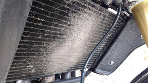 What is the best way to clean a motorcycle radiator