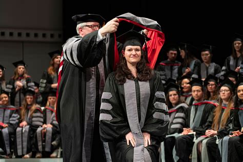 What is a Graduate Hooding Ceremony? A Hooding Ceremony celebrates the ritual of placing the Master’s, Specialist in Education, or Doctoral hood on your shoulders, thereby symbolizing your attainment of an advanced degree. Is the Hooding Ceremony different than commencement? 