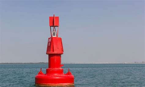 When returning from sea a red navigational buoy?