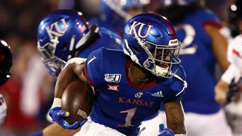 What channel is KU football game on? In their last Big 12 matchup of the season, the Jayhawks (2-9, 1-7 in Big 12 Conference) will play the Mountaineers (5-6, 3-5 in Big 12) at home. Fans that can’t make it to David Booth Memorial Stadium can watch the game on Fox Sports. Kickoff is set for 6 p.m. CT. What station is KU game on today?. 
