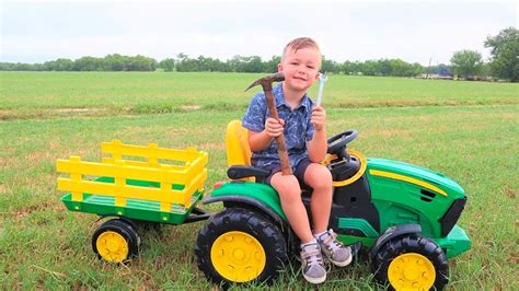 Children driving tractors and trailers on the farm. John Deere tractors and trailers for kids. Real tractors bailing and potatoe harvesting. Forage harveste...