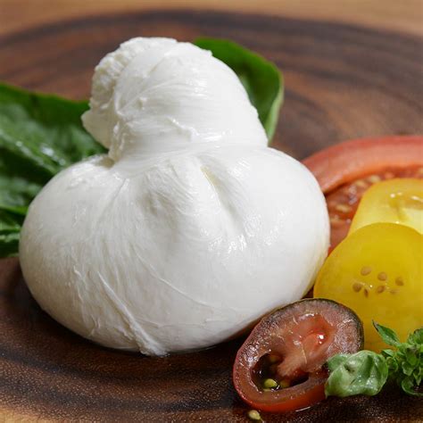 Creamy, soft and fresh Burrata cheese. Made with Mozzarella and fresh cream. The outer shell is a sheet of Pasta Filata (Mozzarella) and while the inside contains Stracciatella (strings of fresh mozzarella cheese curds). 15 days shelf life. 1 unit per tub. Available in 200 g. Out of stock. SKU: 628110775047 Category: Soft Cheese.. 