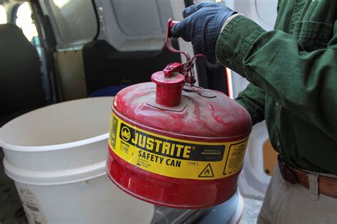 Where to dispose of gasoline. Keep away from children or pets. 1. Fill a bucket or container with water. 2. Submerge the gas soaked paper towels in the water. 3. Leave them in the water for several hours. 4. Carefully remove the paper towels and dispose of them in accordance with local regulations. 