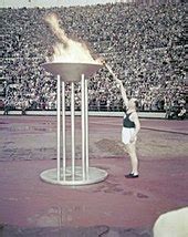 Which city was the first to light the Olympic flame?