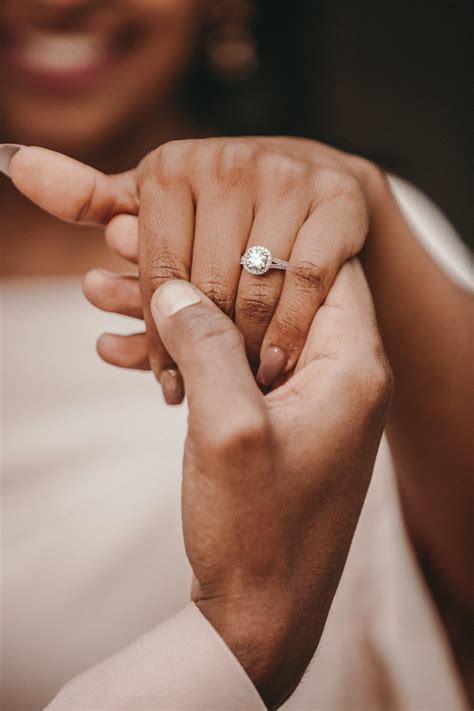 Which hand is the engagement hand. This pose conveys warmth and intimacy while keeping both of the couple’s faces in frame. 4. Holding faces close together. For a more personal engagement portrait, photograph the couple standing nose-to-nose or forehead-to-forehead. Get pictures with their eyes both open and closed to capture different moods. 