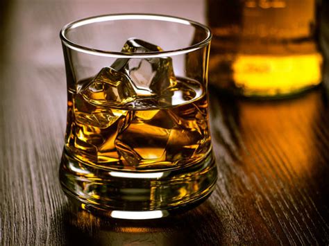 Whiskey on the rocks. Kentucky bourbon is a type of whiskey that has been made in the United States since the 18th century. It is made from a mash of at least 51% corn, and is aged in charred oak barrel... 