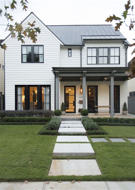 White and black houses. 23 Houses With Black Front Entry Door Ideas. Featured Image: Matthew Cunningham Landscape Design LLC. The color black is a flexible color that transcends architectural designs and styles. It can enhance the elegance … 