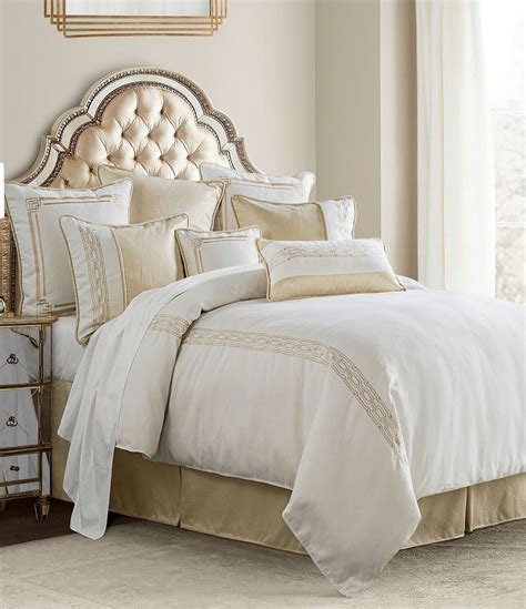 White and gold comforter. The comforter features pintuck and pleated details in a variety of fashionable fade-resistant hues to enhance your bedroom décor. It is also perfectly stuffed with the right amount of poly fiber to provide a level of warmth that is comfortable in all seasons. Matching shams (one in Twin) complete the look. Crafted from 100% polyester, this set ... 