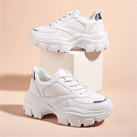 White chunky sneakers. Sneakers with contrast materials and colours on the upper. Seven-eyelet facing. Contrast colour piece at the back. Chunky sole with irregular design. 