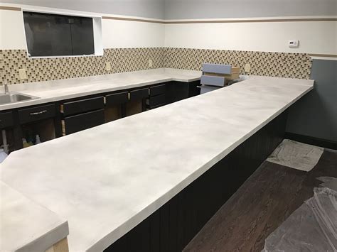 White concrete countertop. White and gray portland cement are very similar to each other, and can be safely blended together. You can use one color cement for a core mix and a different ... 