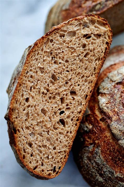 Whole wheat sour dough bread. Dump out the dough onto a lightly floured surface and divide the dough into two masses. Lightly shape each mass into a round, cover with an inverted bowl or moist towel, and let rest for 20 minutes. After, … 