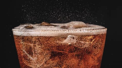 Why do some carbonated drinks fizz more than others?