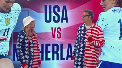 Why is Tim Ezell wearing a USA onesie?