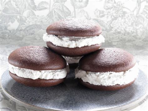 Wicked whoopies. Preheat oven to 350 degree F. Spray baking sheet or whoopie pie pan. In a large mixing bowl mix together butter, sugar, baking powder, baking soda, salt and vanilla. Once mixed, add in the egg and continue beating until all smooth. Add in cocoa powder and continue mixing. 