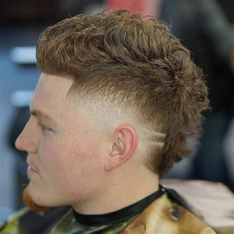 Wide mohawk + temple fade. #fauxhawk #mohawk #texturedhair #texture #templefade #2000s #numetal #milleniumhair #mullet #barber #barbershop #menshair. d.higgs · Out My Way (feat.... 