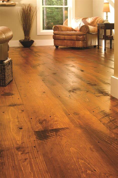 Wide plank hardwood flooring. The sheer beauty of a hardwood floor made from solid planks is an amazing sight. The long, broad planks, with all their natural details, adds a sense of calming ... 