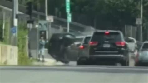 Wild crash caught on camera in Dorchester sends car airborne, narrowly missing pedestrian