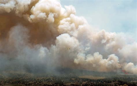 Wildfire in Canadian province contained, while another burns out of control