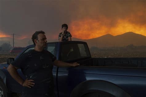 Wildfires torment Greece. California digs out from Hilary. What to know in extreme weather now