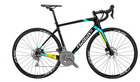 The Wilier GTR Team Disc, Scott Addict 20 disc, and Giant TCR Advanced 2 Disc are all carbon frame road bikes with upper mid-range components and hydraulic disc brakes. The GTR Team Disc has a rigid seatpost, while the TCR Advanced 2 Disc has higher gearing.. 