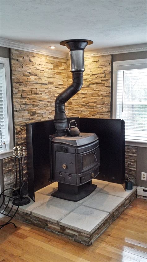 Will a wood stove heat a room better with the doors open or closed?