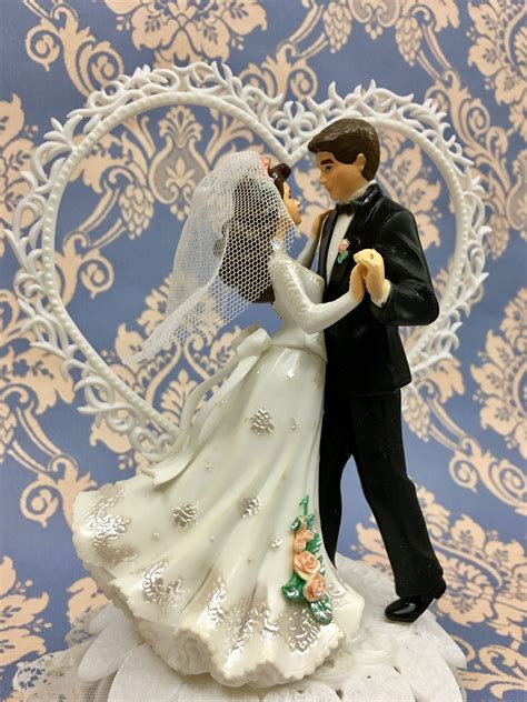 Wilton wedding toppers. Check out our humorous wedding cake toppers selection for the very best in unique or custom, handmade pieces from our cake toppers shops. Get an EXTRA $5 OFF! Min. $30 order. Ends 11/27. ... Vintage 1970s Wilton Wedding Cake Topper, Hand-painted Cartoon Bride & Groom, (2.1k) $ 34.95. FREE shipping Add to Favorites ... 