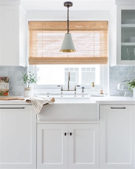 Window treatments for kitchen. Jane Beiles for Georgia Zikas. Off-white curtains are ideal for a classic, elegant space, bringing functionality without overwhelming the decor. "The beauty of a sliding glass door is in its functionality, so you want any sort of window treatment you give a sliding glass door to maximize its functionality, not reduce it," designer Georgia Zikas … 