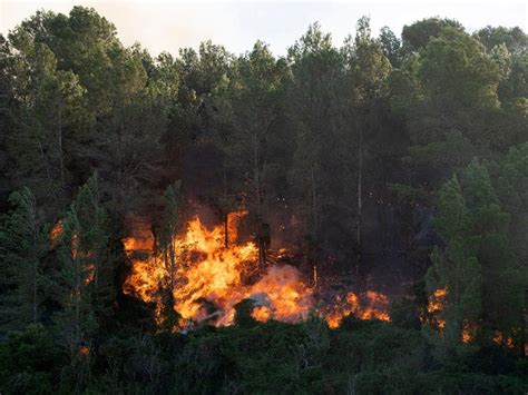 Winds from Storm Ciarán whip up a wildfire in eastern Spain as 850 people are evacuated
