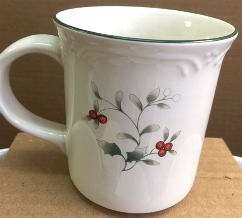 The timeless Winterberry motif on this set of four coffee mugs is sure to warm your heart as you sip your morning cup of coffee, tea, or hot cocoa. From Pfaltzgraff. Includes four 13-oz mugs. Made of stoneware. Microwave and dishwasher safe; not for use in oven or on direct heat. Made in China.. 