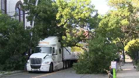 Wires fall on tractor-trailer in Cambridge