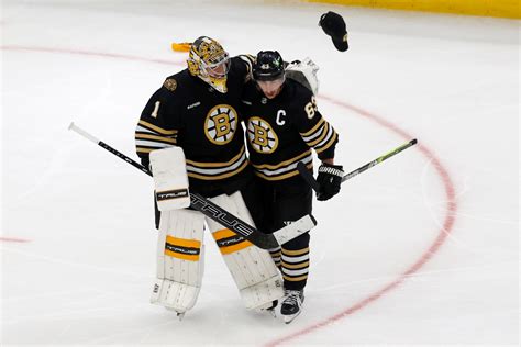 With heavy heart, Brad Marchand lifts Bruins over Columbus with hat trick