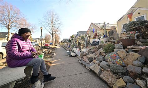Woman’s decades-old mosaic of yard rocks and decorative art work may have to go