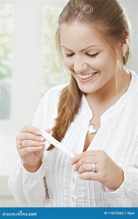 Woman Standing and Holding a Pregnancy Test Stock Image Image of