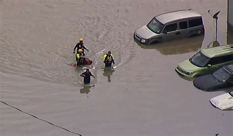 Woman found dead in car after being swept away in high water