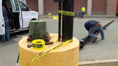 Woman hurt when light pole falls in parking lot - Yahoo News