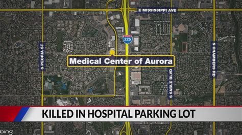 Woman lying down in Aurora parking lot run over, killed Sunday