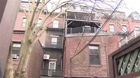 Woman taken to hospital after fall from third-floor balcony in Boston