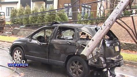 Woman thankful to be alive after utility pole, transformer, wires fall on car in Newton