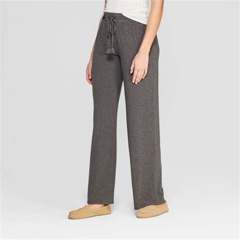 Women's beautifully soft pajama pants. Piece 1: Solid Jersey Sleep Shirt Front Button Down. Piece 1 Material: 95% Modal & 5% Spandex. Piece 2: Solid Pajama Pant. Piece 2 Material: 95% Modal and 5% Spandex. Piece 2 Garment Closure: Front Drawstring, Pull-On. Sleeve Length: Short Sleeve. Inseam Length: 30.5 Inches. Garment Details: Side Pocket, Front Pocket, Full Waistband Elastic ... 