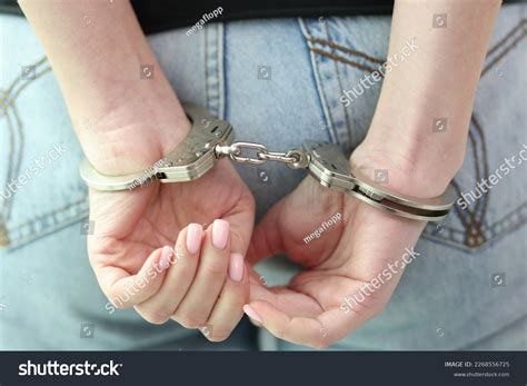Women in handcuffs downe tack. .  ...