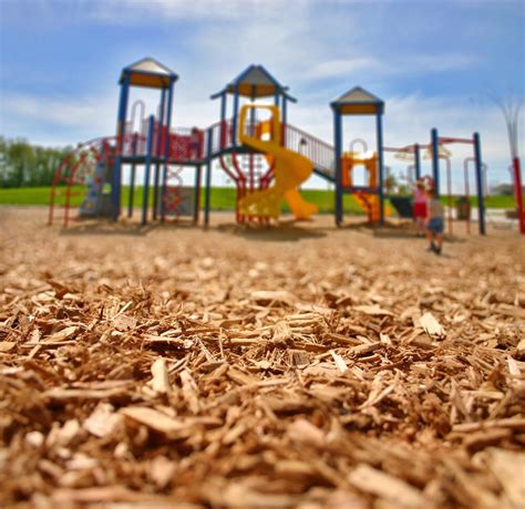 Wood chips for playground. May 30, 2023 ... When laying down your playground mulch, you should only spread it to a required depth of six inches. Anything deeper than that can create a ... 